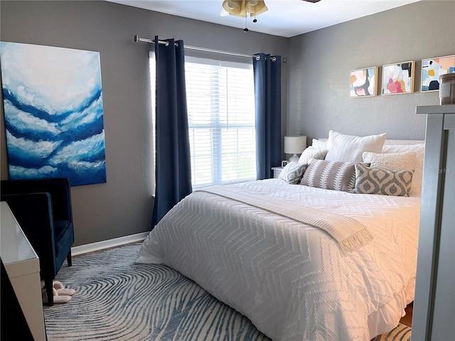 bedroom featuring baseboards