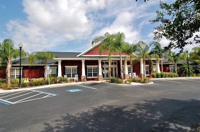 view of building exterior featuring uncovered parking