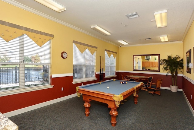 game room featuring visible vents, plenty of natural light, carpet, and ornamental molding