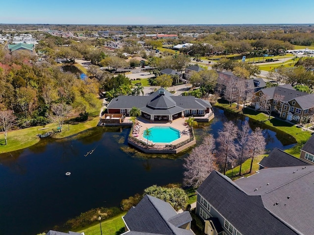 drone / aerial view with a water view and a residential view