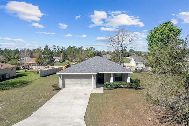 ranch-style house with a shingled roof, a front lawn, fence, concrete driveway, and an attached garage