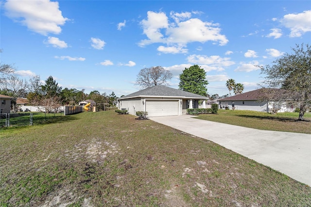 ranch-style home with a front yard, fence, driveway, an attached garage, and stucco siding