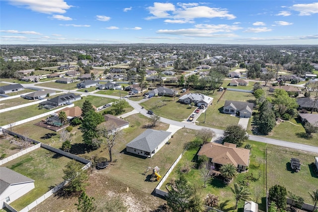 birds eye view of property with a residential view