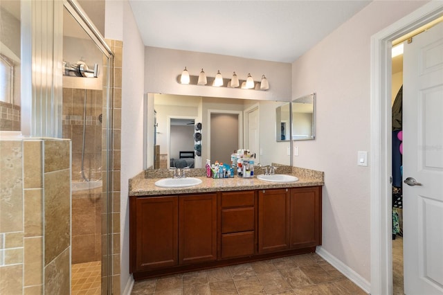 ensuite bathroom featuring ensuite bath, a stall shower, and a sink