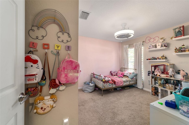 carpeted bedroom with visible vents and baseboards