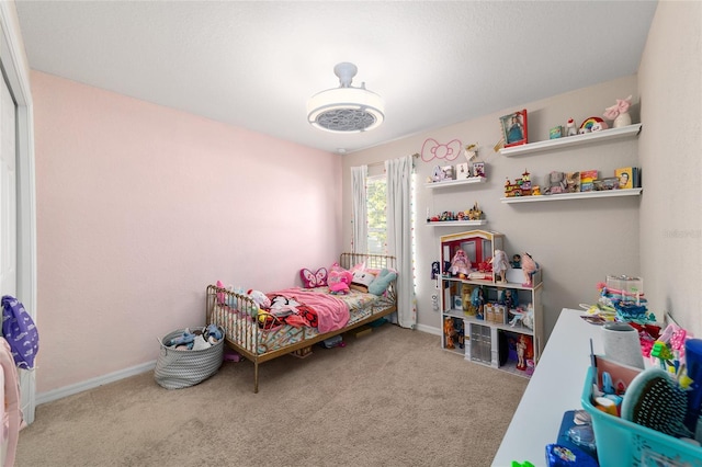 carpeted bedroom with baseboards