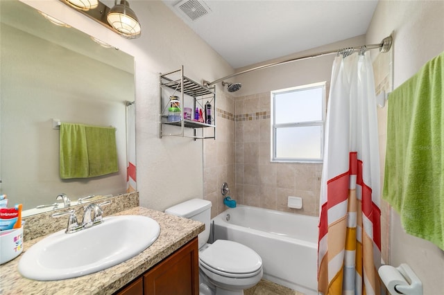 full bathroom featuring vanity, shower / bath combo with shower curtain, toilet, and visible vents