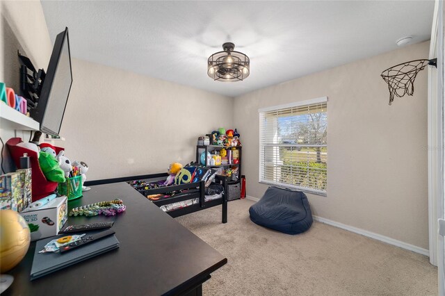 carpeted home office with baseboards