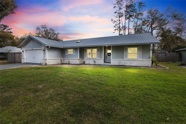 single story home featuring fence, driveway, a garage, brick siding, and metal roof