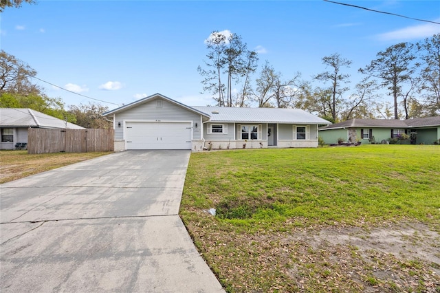 ranch-style home featuring fence, driveway, a front lawn, a garage, and metal roof