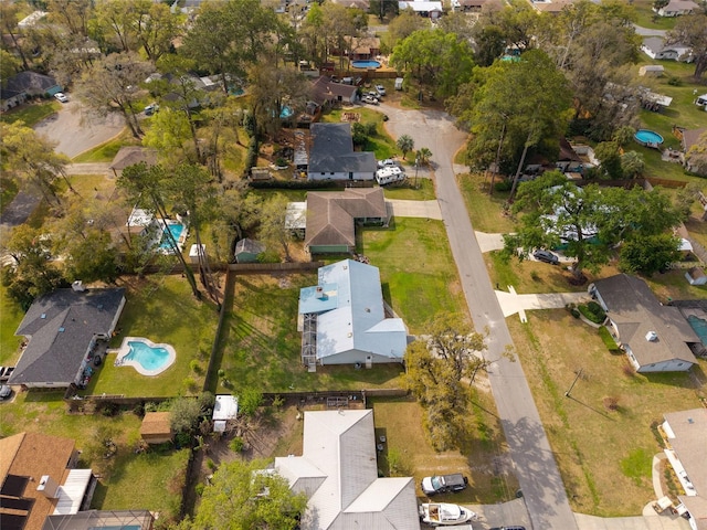 birds eye view of property with a residential view