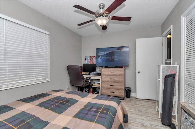 bedroom featuring ceiling fan and light wood-style flooring