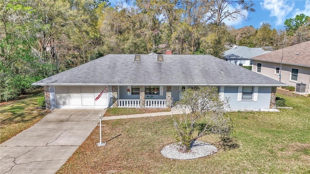 view of front of house with covered porch, driveway, a front yard, and roof with shingles