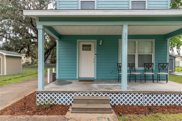 view of exterior entry featuring a porch