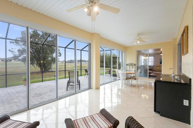 unfurnished sunroom featuring a sink