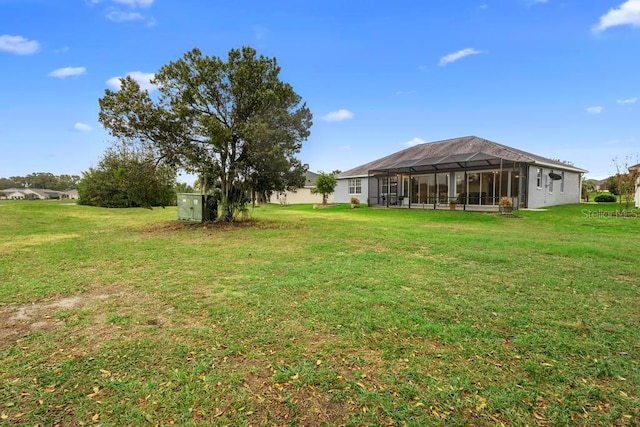 view of yard featuring a lanai