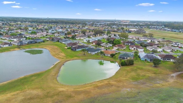 bird's eye view with a residential view and a water view