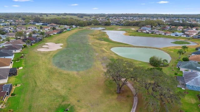 bird's eye view featuring a residential view, golf course view, and a water view