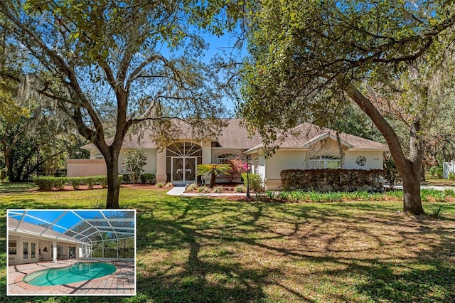 exterior space featuring a swimming pool and a yard