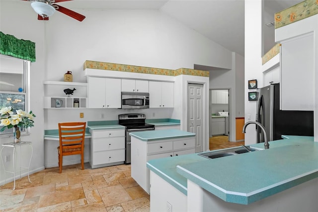 kitchen with high vaulted ceiling, a peninsula, a sink, stainless steel appliances, and white cabinetry