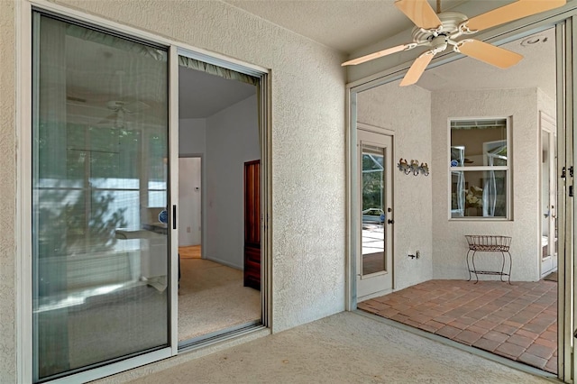 interior space featuring ceiling fan