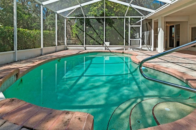 pool with a patio and a lanai