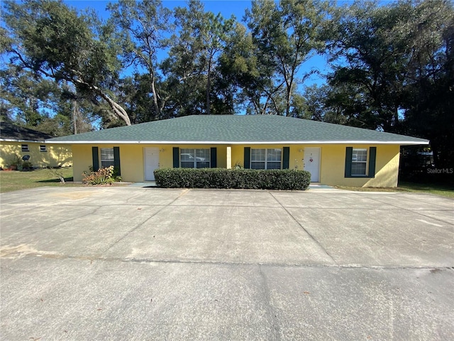 single story home featuring stucco siding