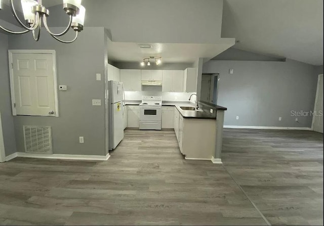 kitchen featuring white appliances, baseboards, visible vents, a sink, and white cabinets