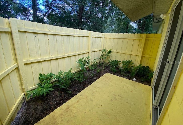 view of yard with a patio and a fenced backyard