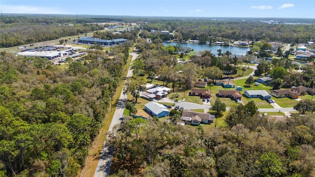 aerial view featuring a view of trees and a water view