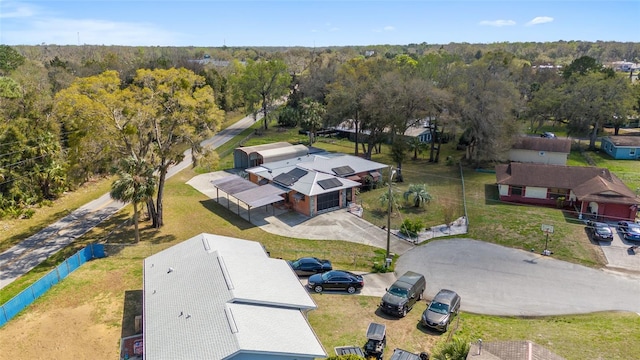 bird's eye view featuring a wooded view