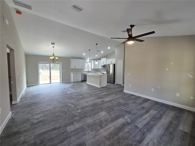 unfurnished living room featuring vaulted ceiling, baseboards, visible vents, and dark wood-style flooring