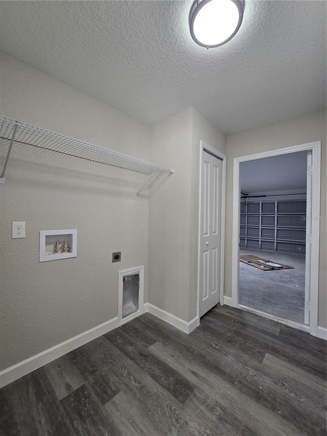 laundry room with electric dryer hookup, a textured ceiling, wood finished floors, baseboards, and hookup for a washing machine