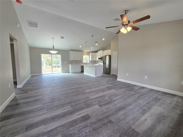 unfurnished living room with visible vents, baseboards, dark wood-type flooring, and ceiling fan