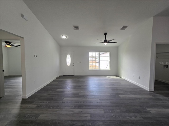 entryway featuring dark wood-style floors, visible vents, a ceiling fan, and baseboards