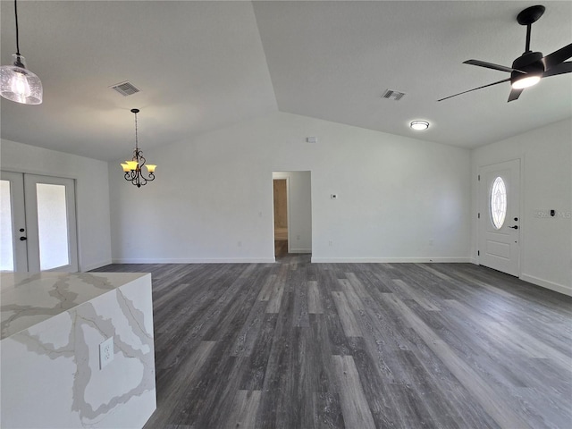 unfurnished living room with visible vents, dark wood-style flooring, vaulted ceiling, and french doors