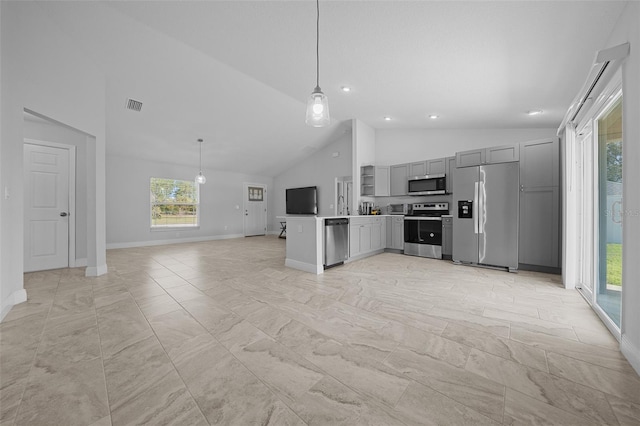 kitchen featuring gray cabinetry, open floor plan, pendant lighting, light countertops, and stainless steel appliances