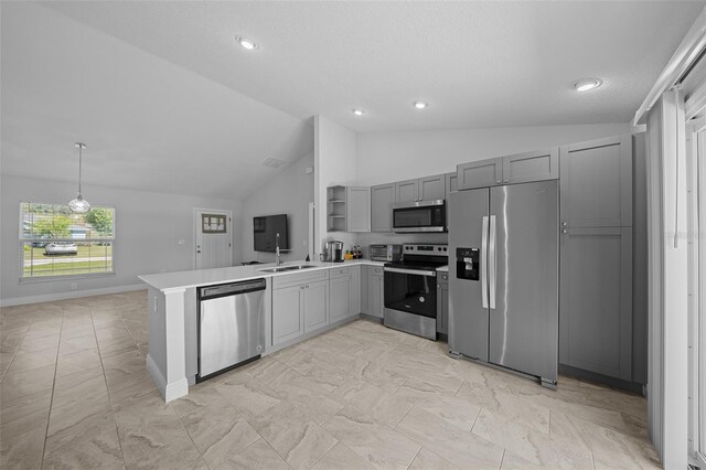 kitchen featuring vaulted ceiling, gray cabinets, a peninsula, stainless steel appliances, and open shelves