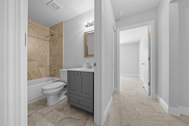 bathroom featuring vanity, toilet, washtub / shower combination, and marble finish floor