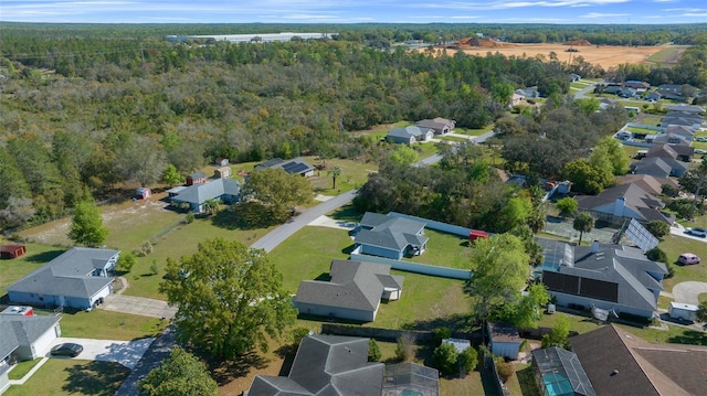 bird's eye view featuring a residential view and a view of trees