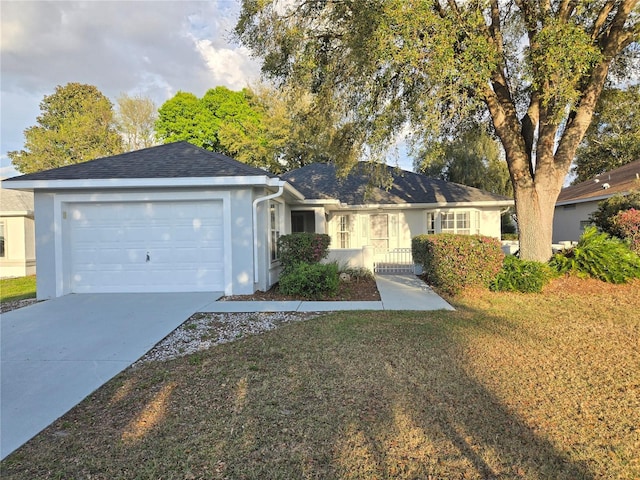 single story home with a garage, driveway, and stucco siding