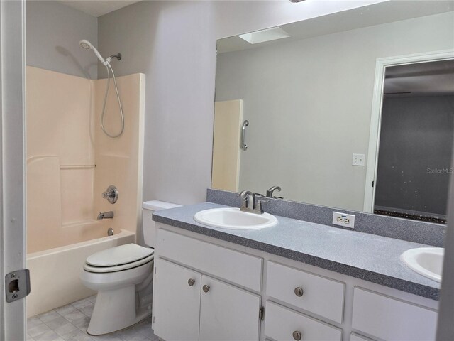 bathroom with vanity,  shower combination, and toilet