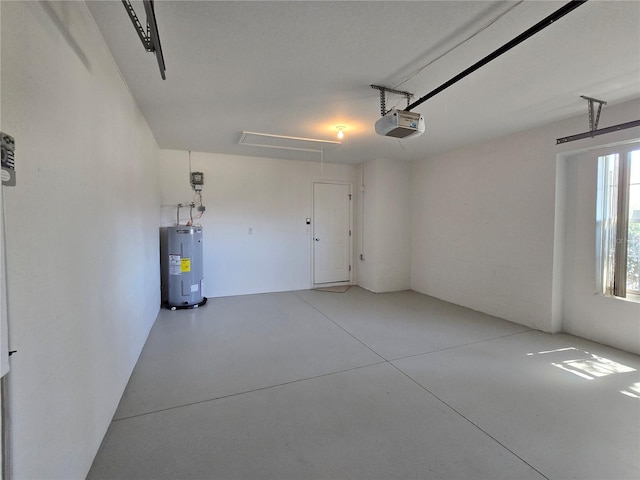 garage featuring a garage door opener and water heater