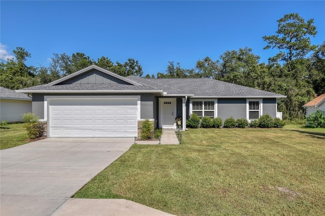 ranch-style house with concrete driveway, a garage, a front yard, and stucco siding