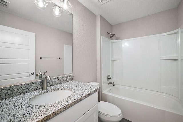 full bath featuring visible vents, toilet, a textured ceiling, vanity, and shower / bathtub combination