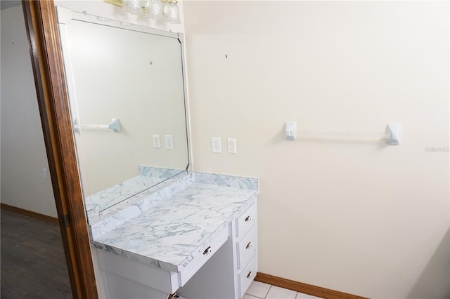 bathroom featuring baseboards and vanity