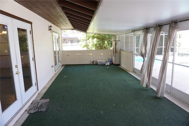 unfurnished sunroom featuring french doors