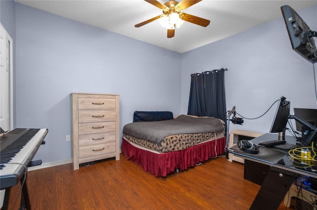 bedroom featuring a ceiling fan and wood finished floors