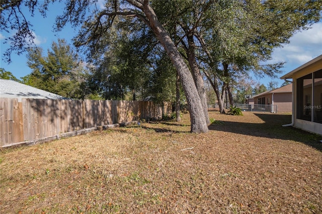 view of yard with a fenced backyard