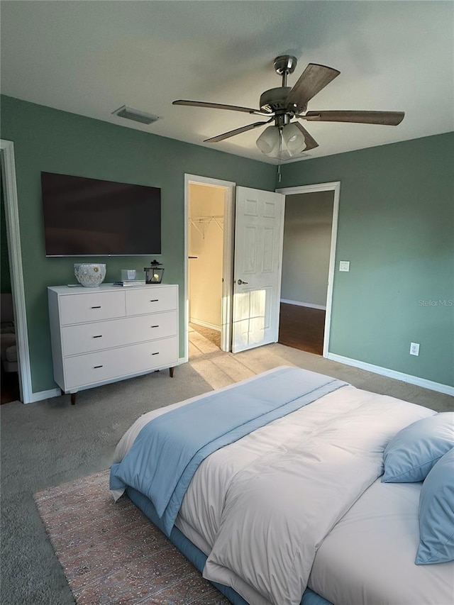 bedroom featuring baseboards, visible vents, and light carpet